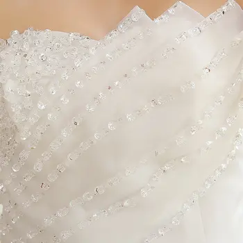 Tas ir YiiYa Kāzu Kleitu Vizuļi Grīdas Garuma kāzu kleitas Strapless bez Piedurknēm Loku Mežģīnes Up Princese Līgavas Bumbu Kleita HS106